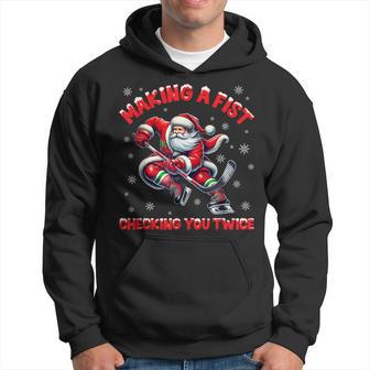 Making A Fist Checking You Twice Ice Hockey Xmas Snowflakes Hoodie - Thegiftio UK
