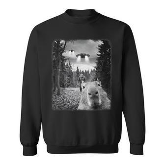 Capybara Taking Selfie With Ufos And Bigfoot Capybara Sweatshirt - Monsterry