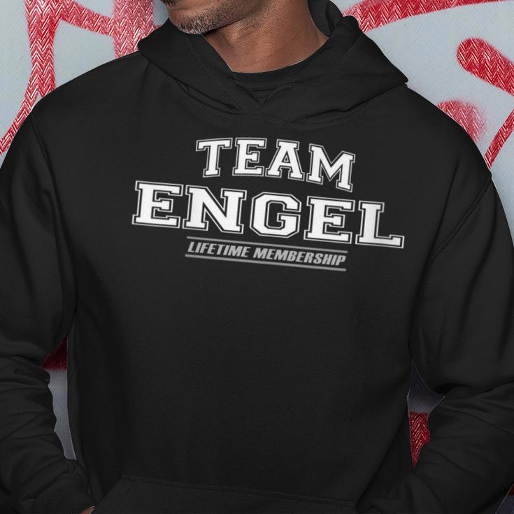 Damen Team Engel Stolzer Familiennachname Nachname Geschenk Mit-Ausschnitt Kapuzenpullover Lustige Geschenke